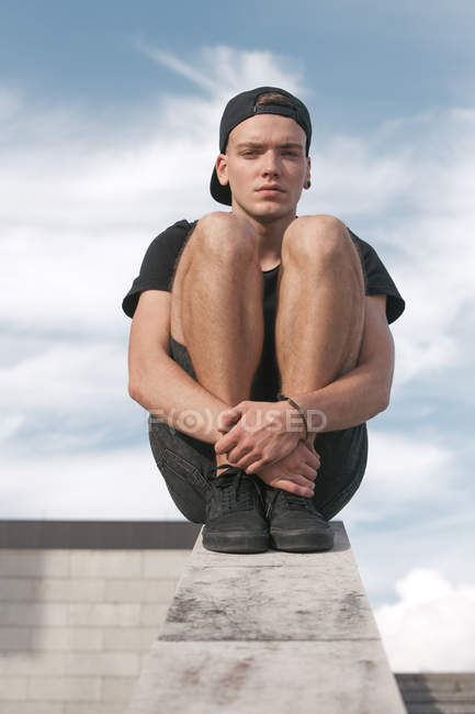 Serious young man in black cap — Stock Photo