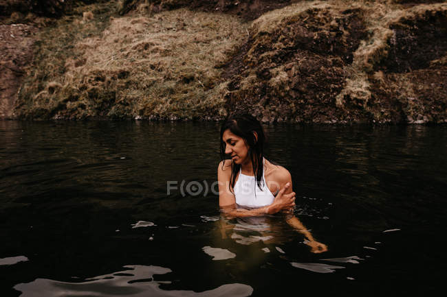 Woman relaxing in hot spring — Stock Photo