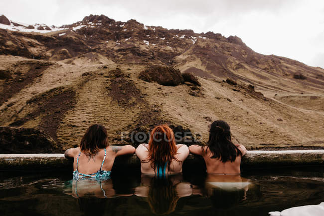 Three women in thermal spring — Stock Photo