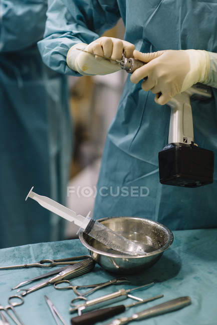 Medic setting drill for surgery — Stock Photo