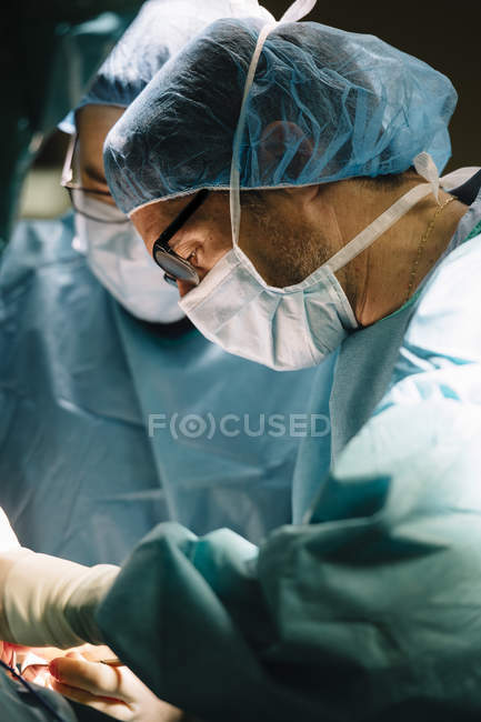Surgeons doing operation in hospital — Stock Photo