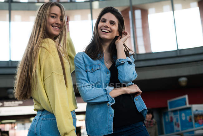 Cheerful women looking at camera — Stock Photo