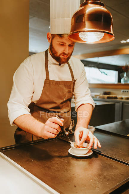 Cheff working in kitchen — Stock Photo