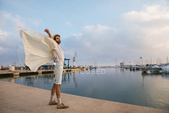 Man stretching at pier — Stock Photo