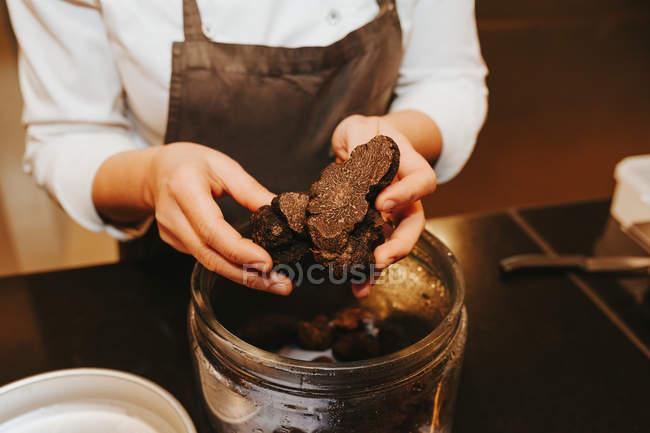 Chef picking ingredient — Stock Photo