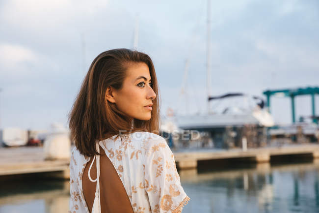 Attractive woman at pier — Stock Photo