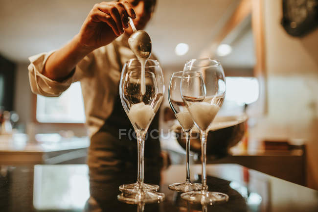 Cook serving glasses — Stock Photo