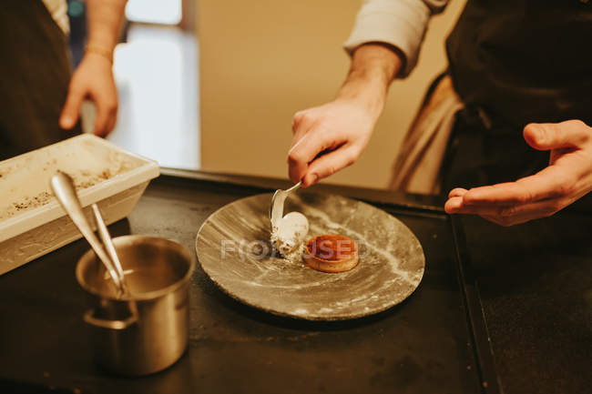 Cook decorating plate — Stock Photo