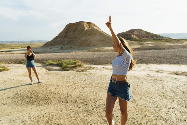 Woman taking shots of friend — Stock Photo