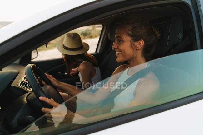 Pretty women riding car — Stock Photo
