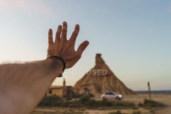 Male hand at cliff — Stock Photo