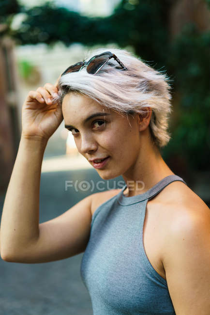 Charming flirty girl posing at street — Stock Photo