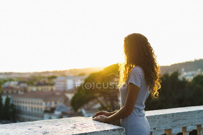 Anonymous woman in old city — Stock Photo