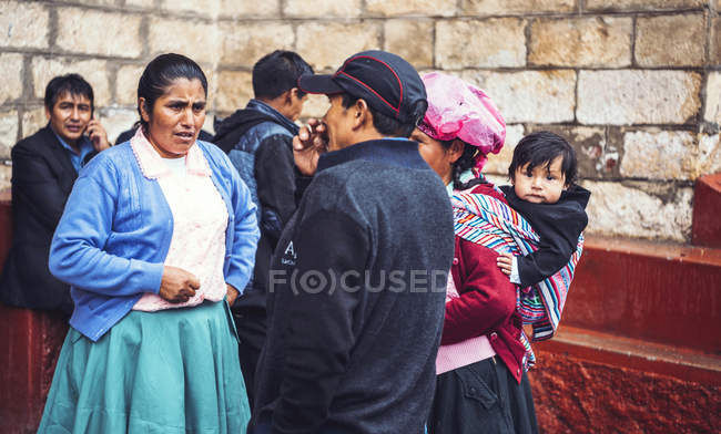 AYACUCHO, PERU - DECEMBER 30, 2016:Group of talking guests at wedding — Stock Photo