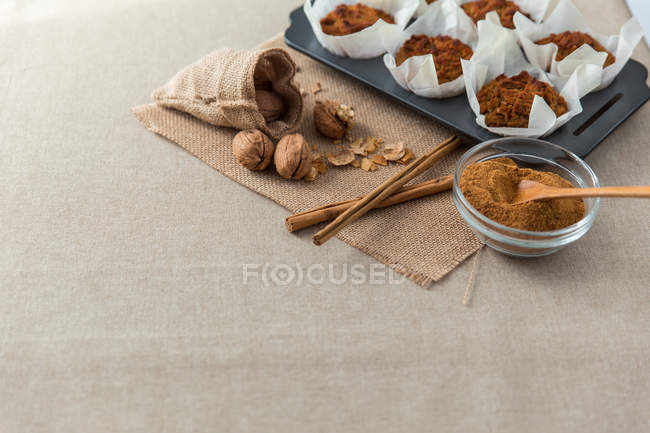 Cupcakes served with spices and nuts — Stock Photo