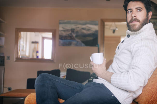 Young man enjoying the comforts of home — Stock Photo