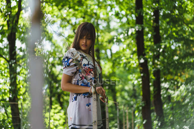Young brunette woman posing in forest — Stock Photo