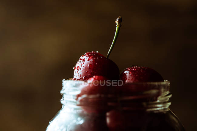 Jar with cherry — Stock Photo