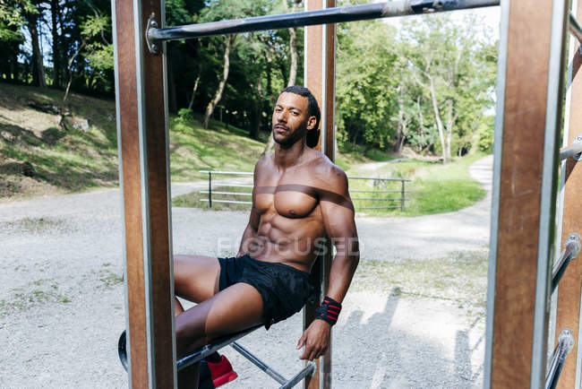 Athlete resting in park — Stock Photo