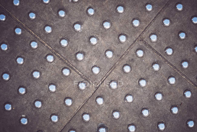 Full frame of metal panel floor with rivets. — Stock Photo