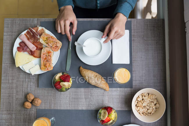 From above view of hands of person having breakfast — Stock Photo