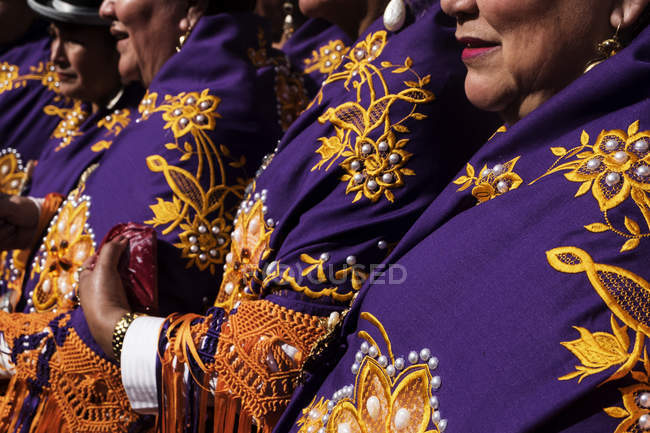 BARCELONA, SPAIN - 21 February, 2016: Crop women wearing colorful traditional garments on festival. — Stock Photo