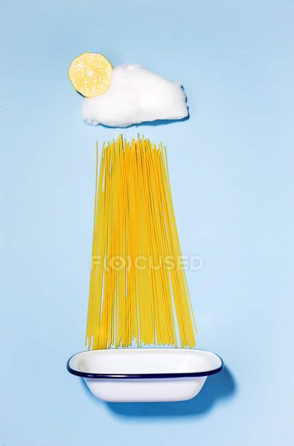 Cotton candy cloud with spaghetti rain — Stock Photo