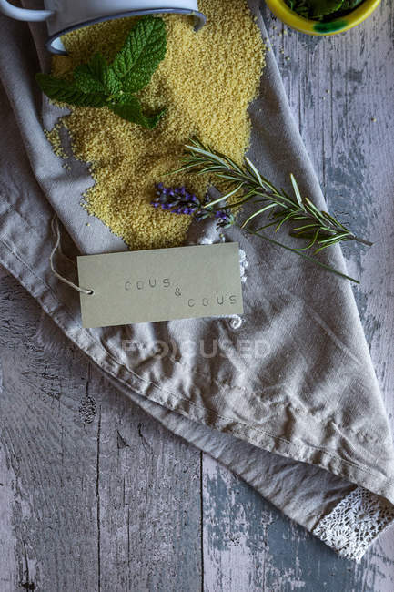 Couscous ingredients on of Decorative Napkin with cardboard sign — Stock Photo