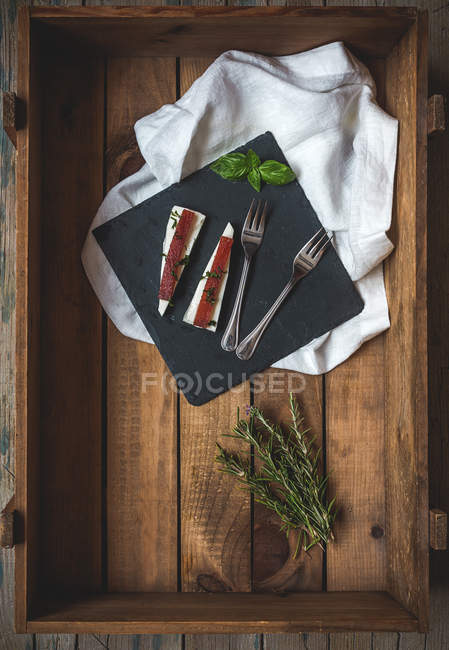 Cheese with jelly on black board — Stock Photo