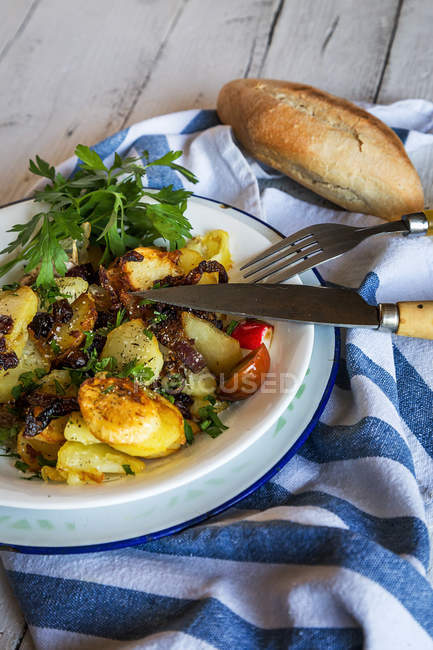 Still life of plate with rural dinner on towel — Stock Photo