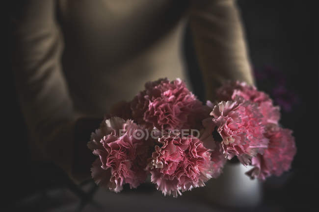Close up view of flower in female florist hands — Stock Photo