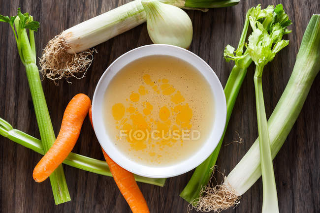 Directly above view of white bowl of seasonable vegs soup. — Stock Photo