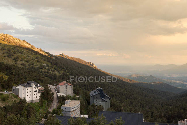 Hillside town at sunset — Stock Photo