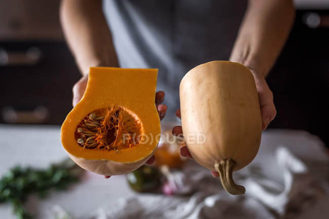 Woman with pumpkin in hands — Stock Photo