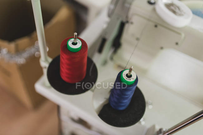 Close up view of red and blue spools on spires — Stock Photo