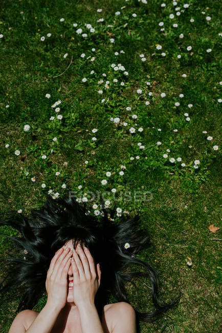 Girl hiding face with hands — Stock Photo