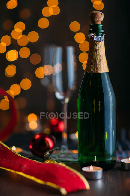Glasses of champagne with candles — Stock Photo