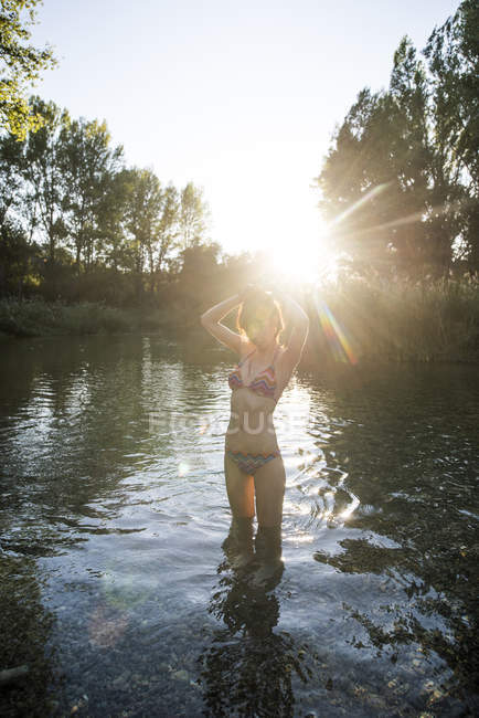 Girl posing in lake — Stock Photo