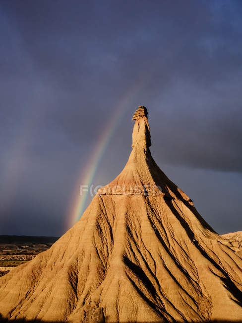 Rock formation with rainbow — Stock Photo