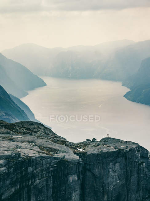 Huge rock over fjord — Stock Photo
