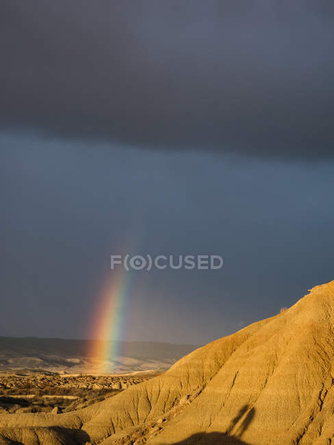 Rock formation with rainbow — Stock Photo
