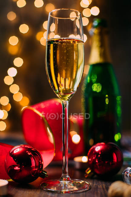 Glass of champagne with Chrsitmas decoration — Stock Photo
