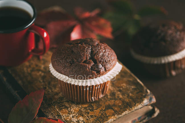 Chocolate muffins with coffee mug — Stock Photo