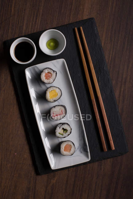 Served sushi set on ceramic plate — Stock Photo
