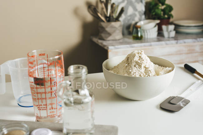 Homemade bread ingridients on kitchen table — Stock Photo