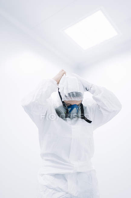 Scientist putting on protective mask in laboratory. — Stock Photo