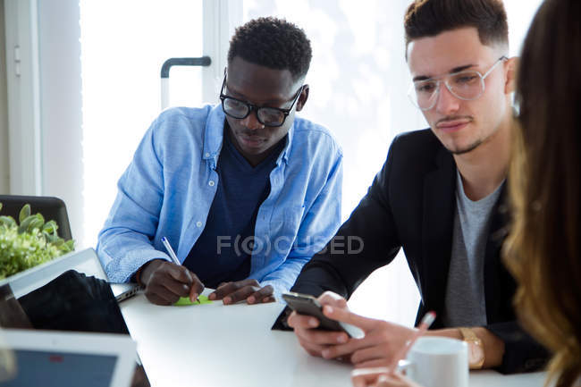 Group of business people working at meeting in modern office. — Stock Photo