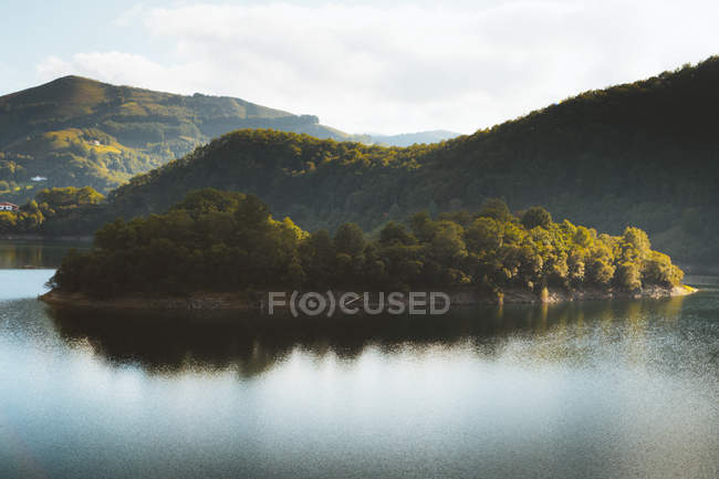 Landscape of mountain lake on sunny day — Stock Photo