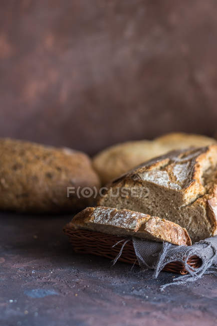 Close up view of various types of home-made bread on table. — Stock Photo