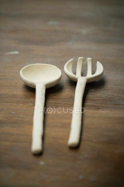 Close up view of handicraft clay cutlery — Stock Photo